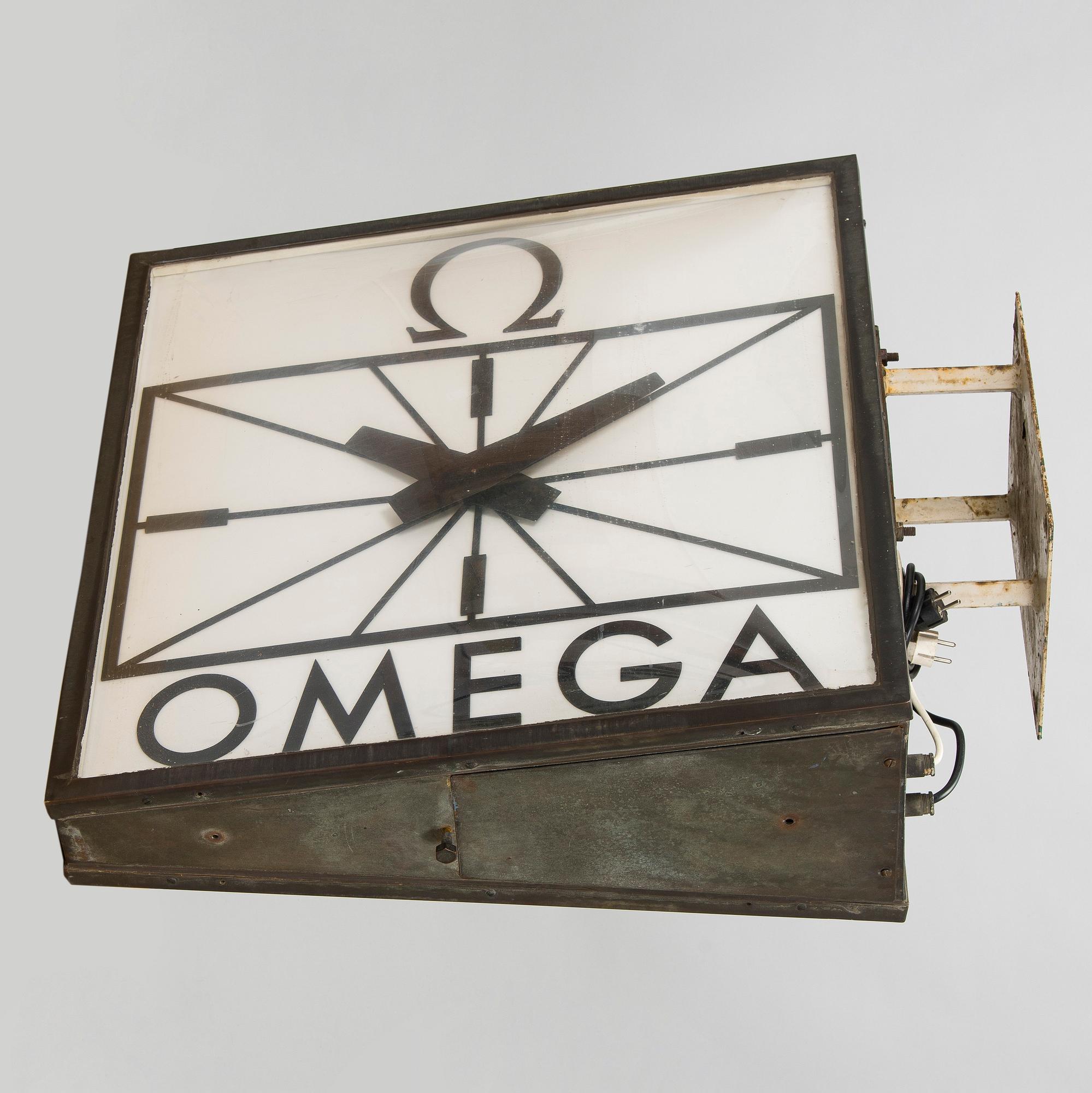 Reklamklocka, Omega, 1900-talets andra hälft.