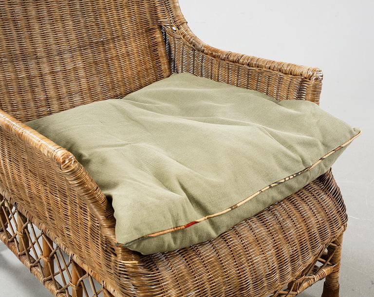A rattan arm chair from the second half of the 20th century.