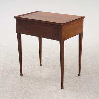 A late Gustavian mahogany writing table from araound the year 1800.