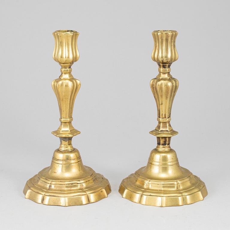 A pair of 18th century bronze candlesticks.