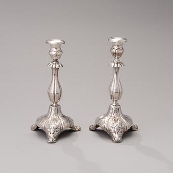 A PAIR OF RUSSIAN SILVER CANDLESTICKS, assay mark of Ivan Yefimovich Konstantinov, Moscow 1875.