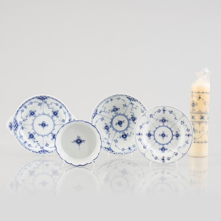 A group of four 'Blue Fluted' / *Musselmalet' porcelain dishes and a candle, Royal Copenhagen, 1893-1900 and later.