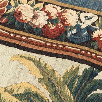 A tapestry, "Verdure", tapestry weave, a so called "entre-fenêtre", ca 298 x 121-127,5 cm, signed M.R.DVBVSON.i.D.