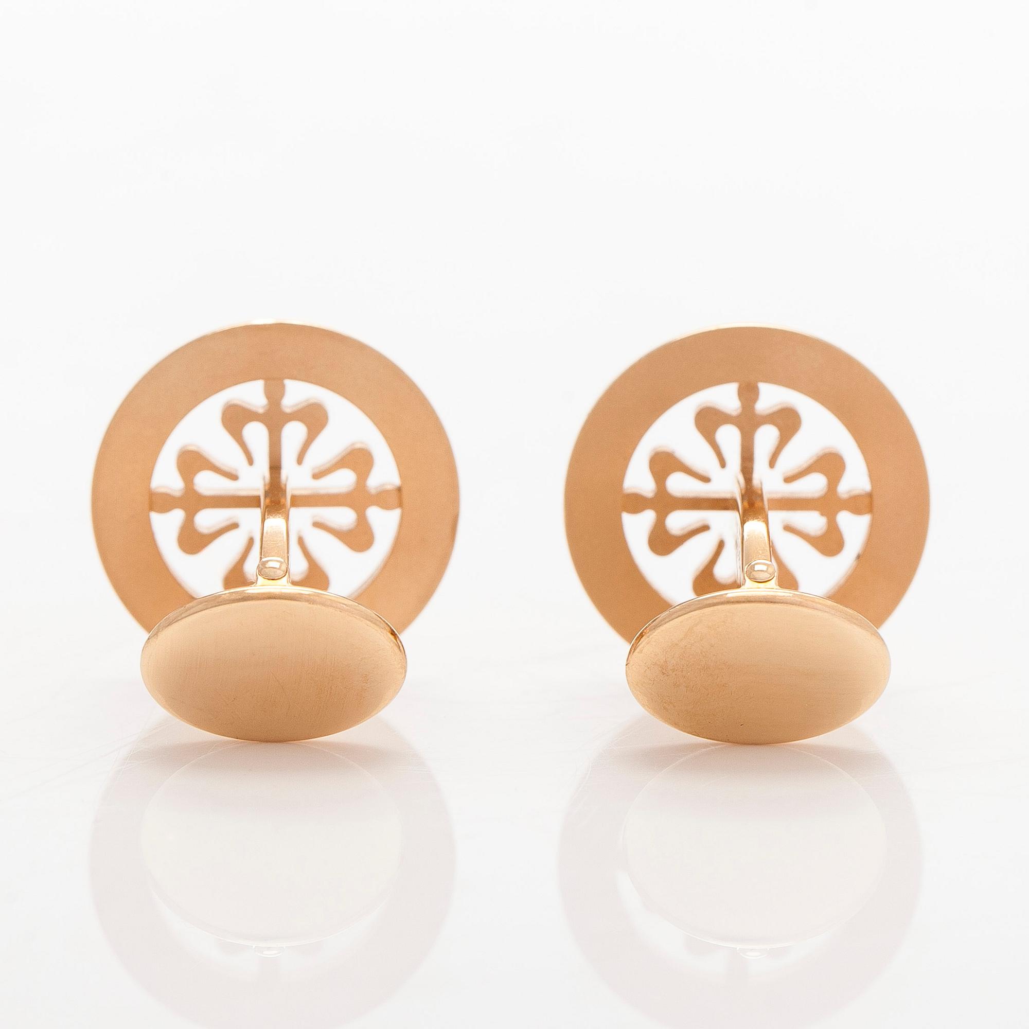 Patek Philippe, a pair of 18K gold "Calatrava" cufflinks.