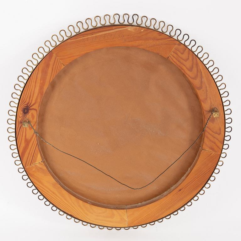 A mid 20th century brass frame mirror.