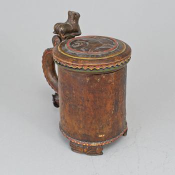 A 19th century painted wooden tankard.