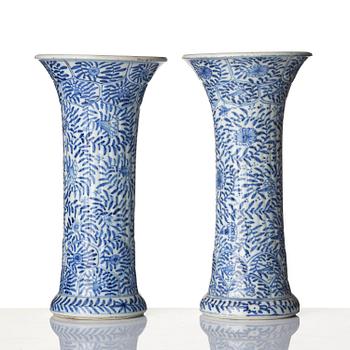 A pair of blue and white 'floral' vases, Qing dynasty, Kangxi (1662-1722).
