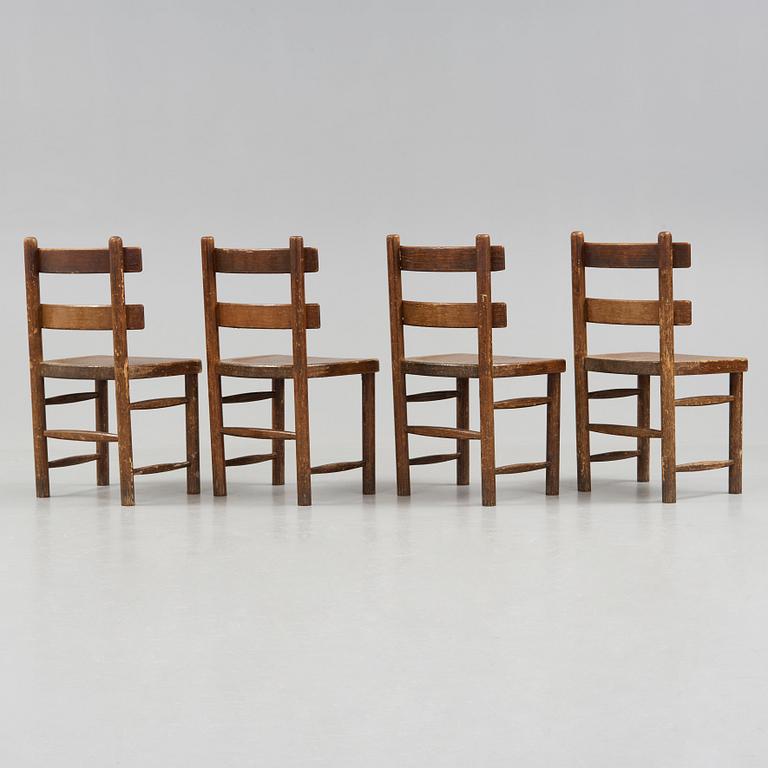 Axel Einar Hjorth, A set of four Axel Einar Hjorth stained and lacquered 'Sandhamn' pine chairs, Nordiska Kompaniet, Sweden post 1929.