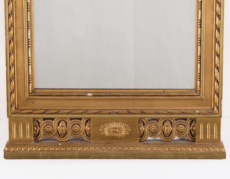 A MIRROR, gustavian style, first half of the 20th century.