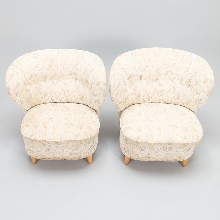 A pair of mid 20th century armchairs.