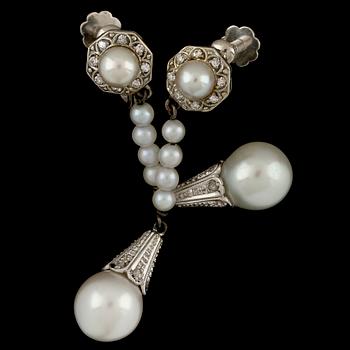 A pair of cultured pearl and diamond earrings, 1941.