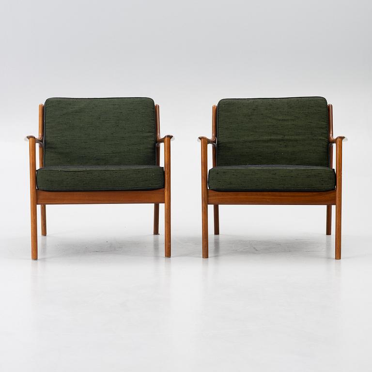 Folke Ohlsson, a pair of 'USA 75' armchairs, Dux, Sweden, 1960's.