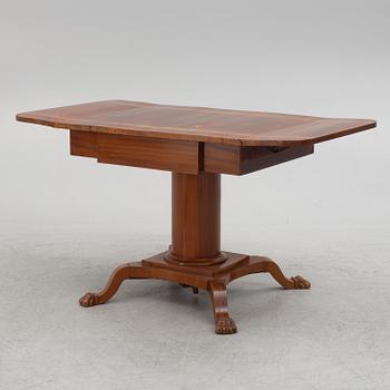 Table with folding leaves, Empire style, 19th century.