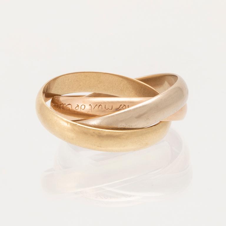 An 18K tri-coloured "Trinity" gold ring by Cartier.