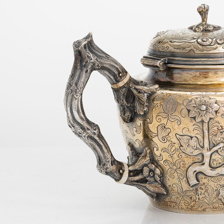 A 9-piece parcel-gilt sterling silver tea set, maker's mark of Samuel Smily, Goldsmiths Alliance Ltd, London 1873-74.