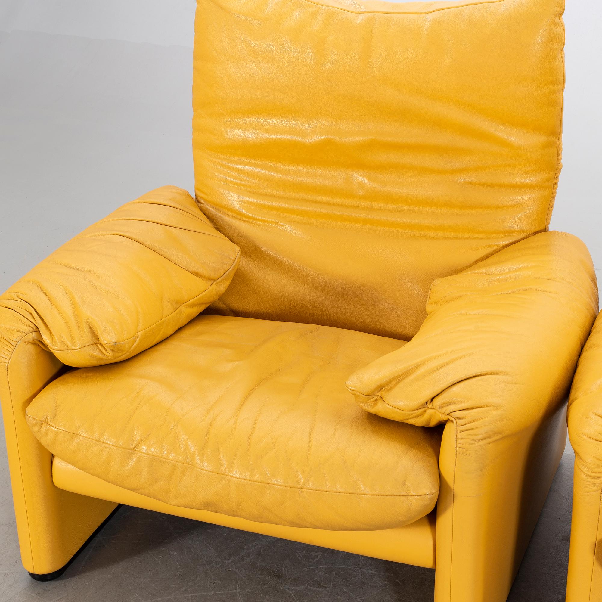 A "Maralunga" leather sofa and easy chair by Vico Magistretti, Italy.