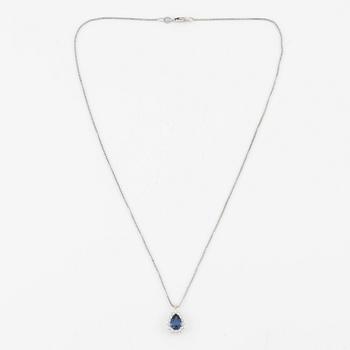 Pendant with 18K gold chain featuring a faceted sapphire and round brilliant-cut diamonds.