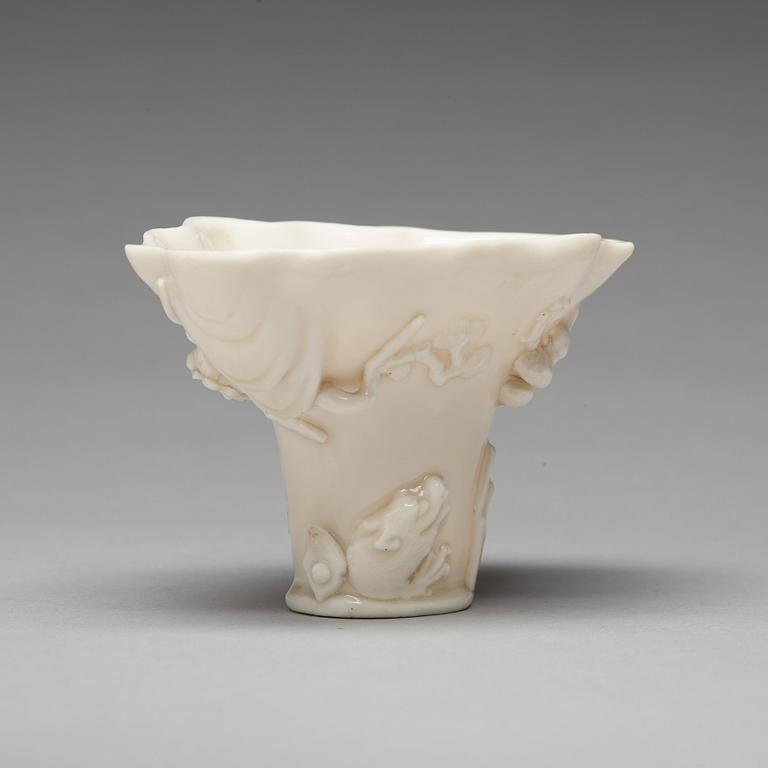 A blanc de chine rhinoserous shaped libation cup, 17th Century.