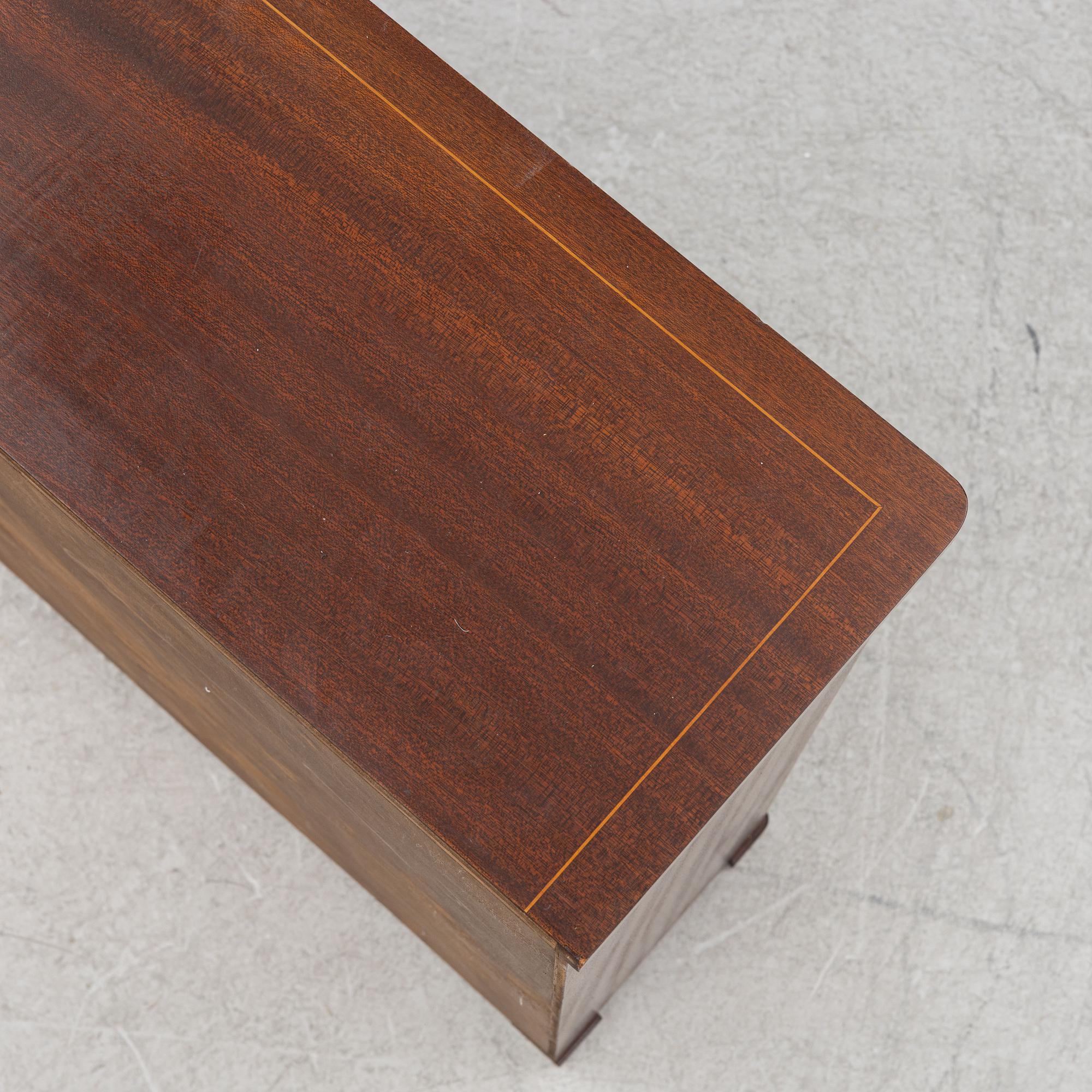 A bookcase, mid-20th Century.