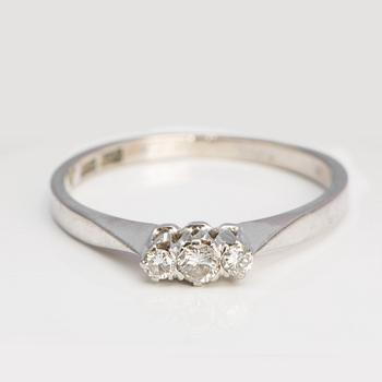 A ca 0.15 ct brilliant-cut diamond ring.