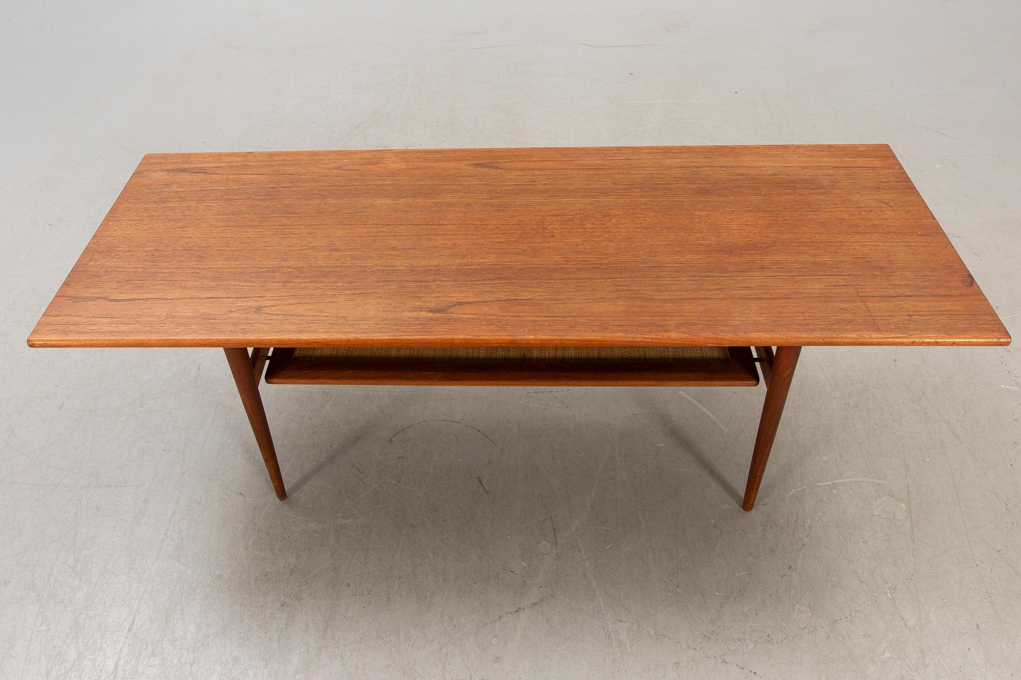 A Dansih 1960s teak and rattan  coffee table.