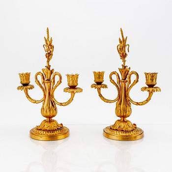 A pair of Louis XV-style bronze candelabras.
