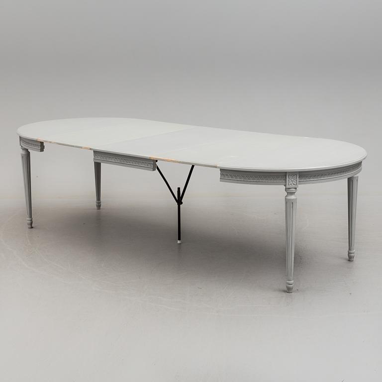 A Gustavian style dining table and ten chairs, 20th century.