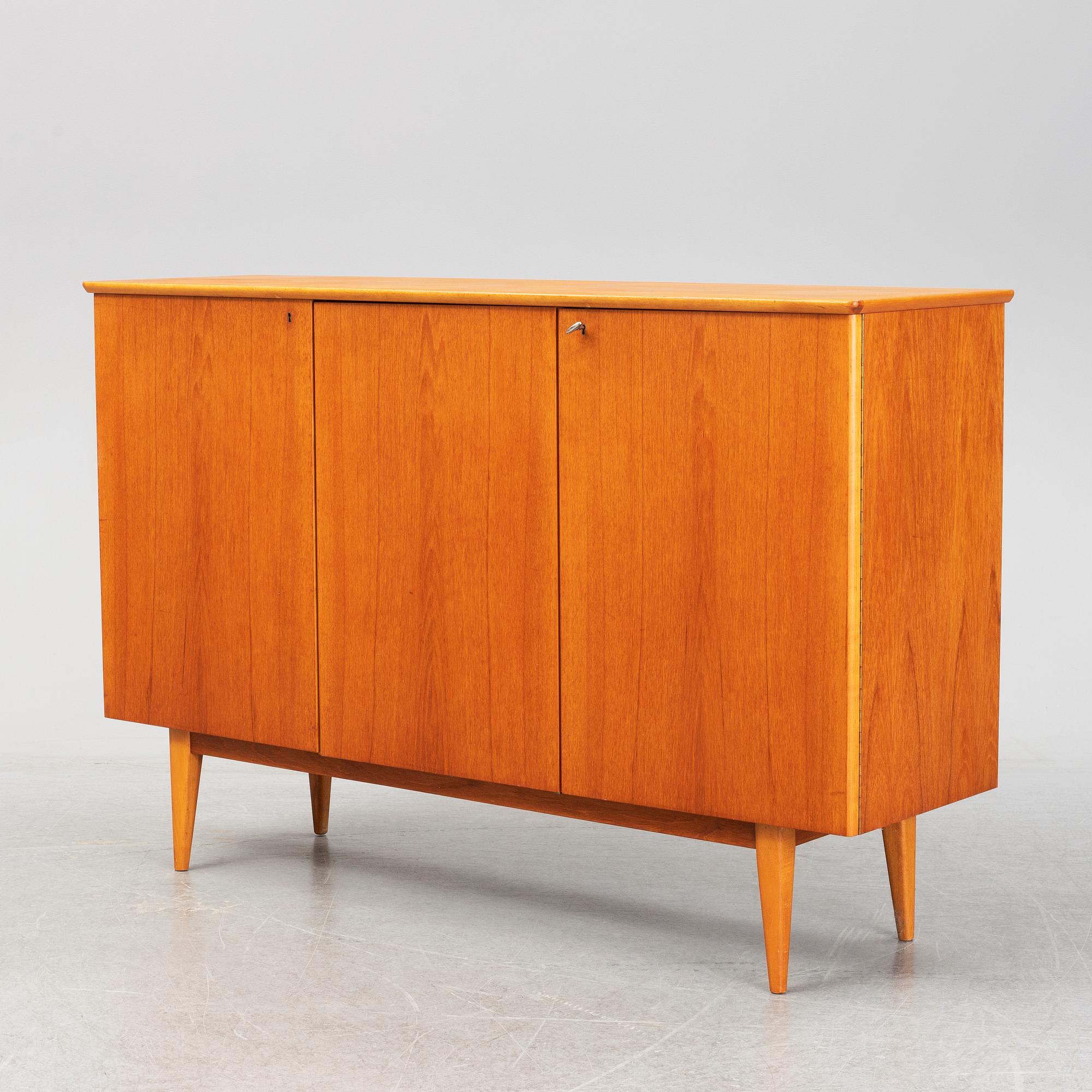 A mid 20th century teak veneered sideboard.