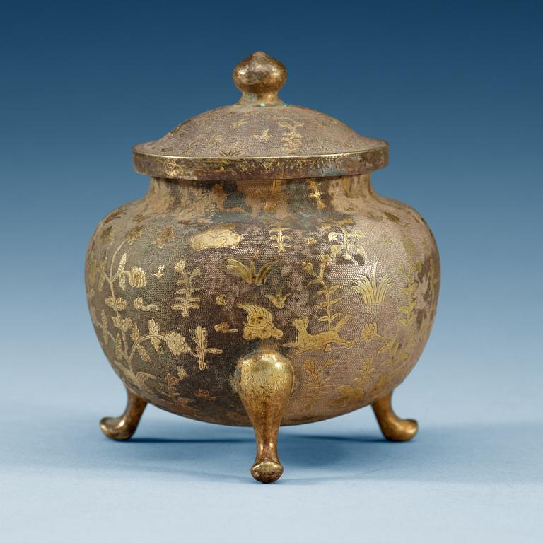 A silver gilt tripod censer, presumably Tang dynasty.