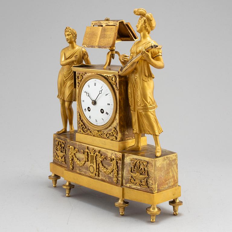 A French Empire gilt bronze mantel clock, first half of the 19th century.