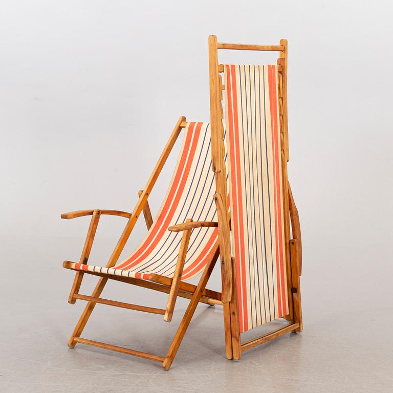 A pair of mid 20th century beach chairs.