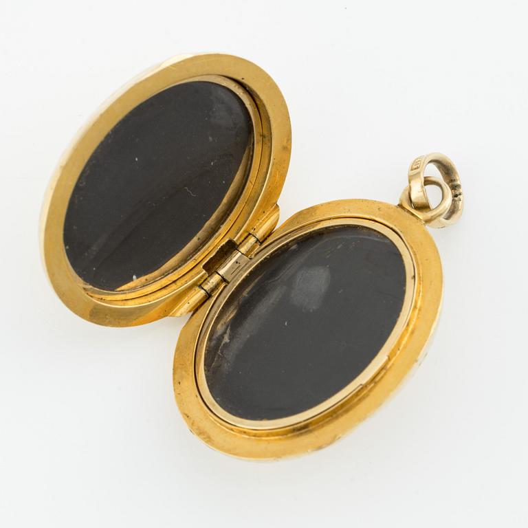 Medaljong/Fotogömma, 18K guld.