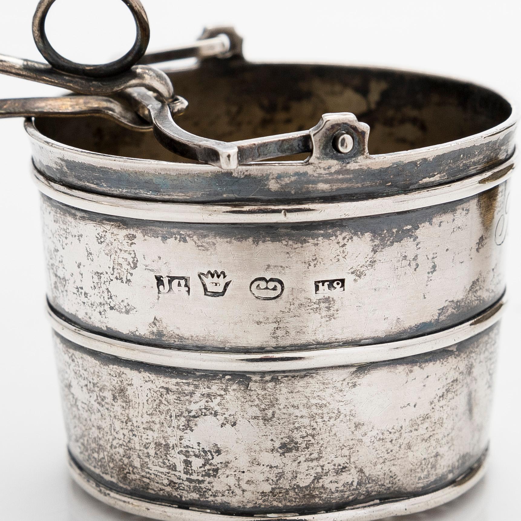 A silver sugar bowl, R. Mellin, Helsinki 1860, and two tea strainers, Kuopio and Porvoo, first half of the 19th century.