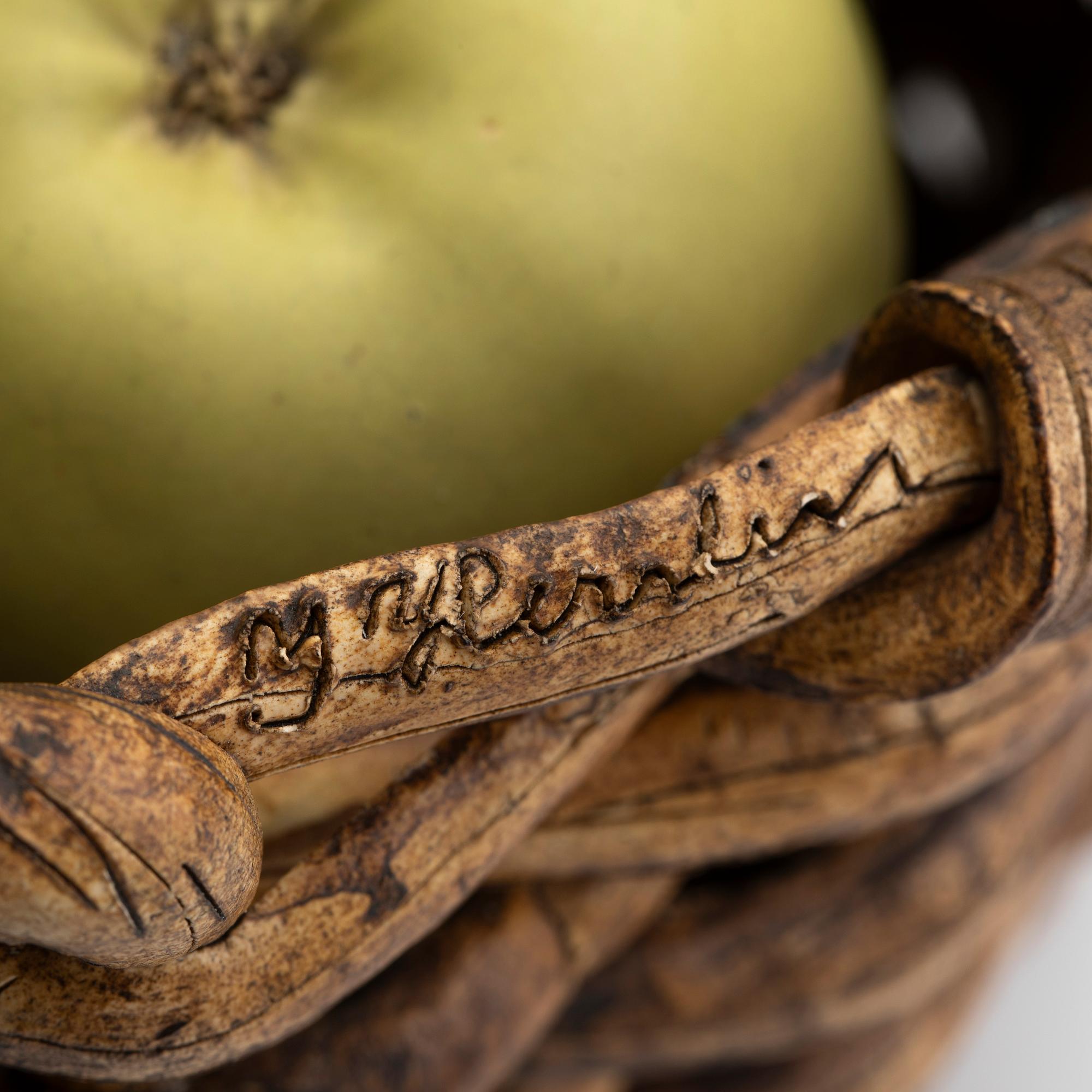 Ingrid Herrlin, a stoneware basket with green apples, own workshop.