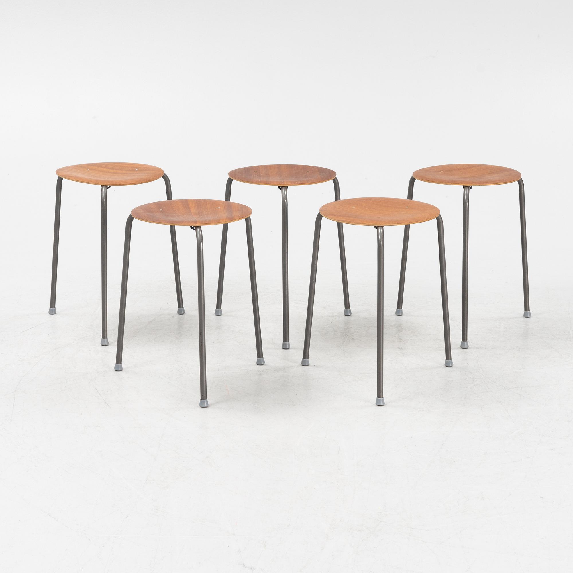 A set of five teak veneered stools, second half of the 20th Century.