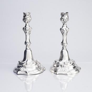 A pair of Swedish Rococo silver candlesticks, marks of Abraham Lundberg, Stockholm 1765.