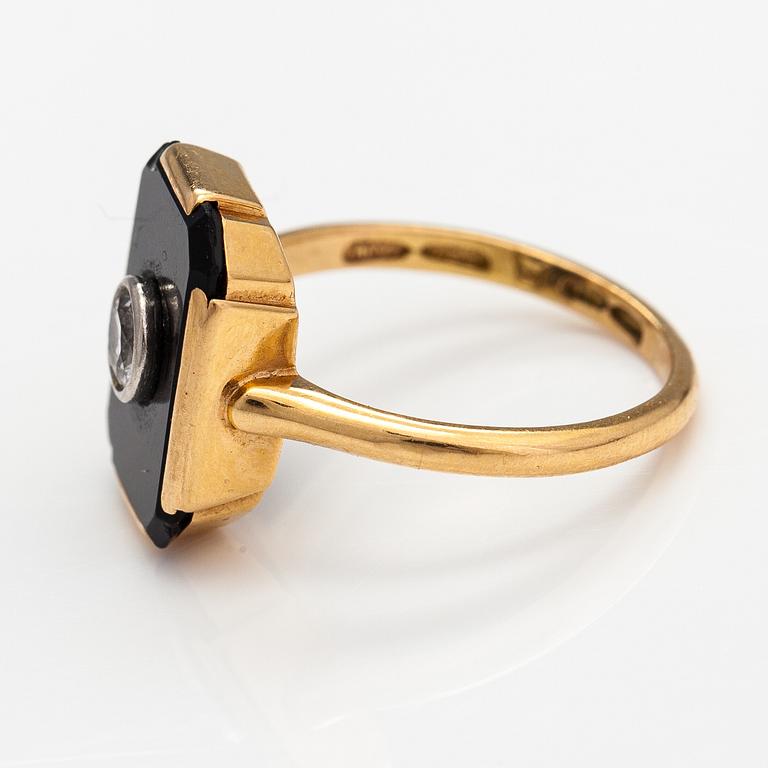 An 1(K gold ring with an onyx and an old-cut diamond ca. 0.18 ct. Westerback, Helsinki 1938.