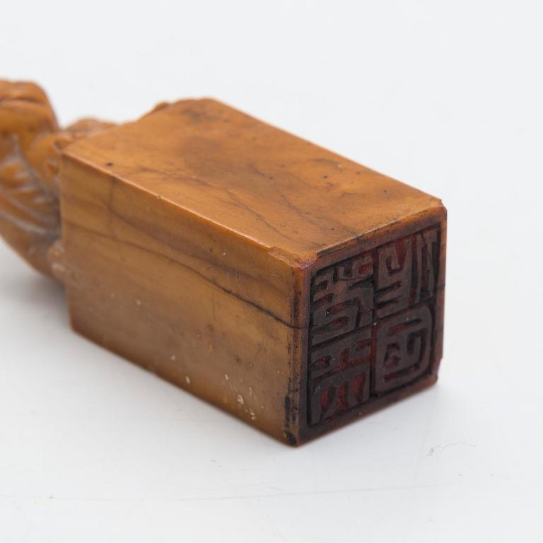 Two pieces of carved agalmatolite, sculpture and seal,one with stamp. China, mid-20th century.