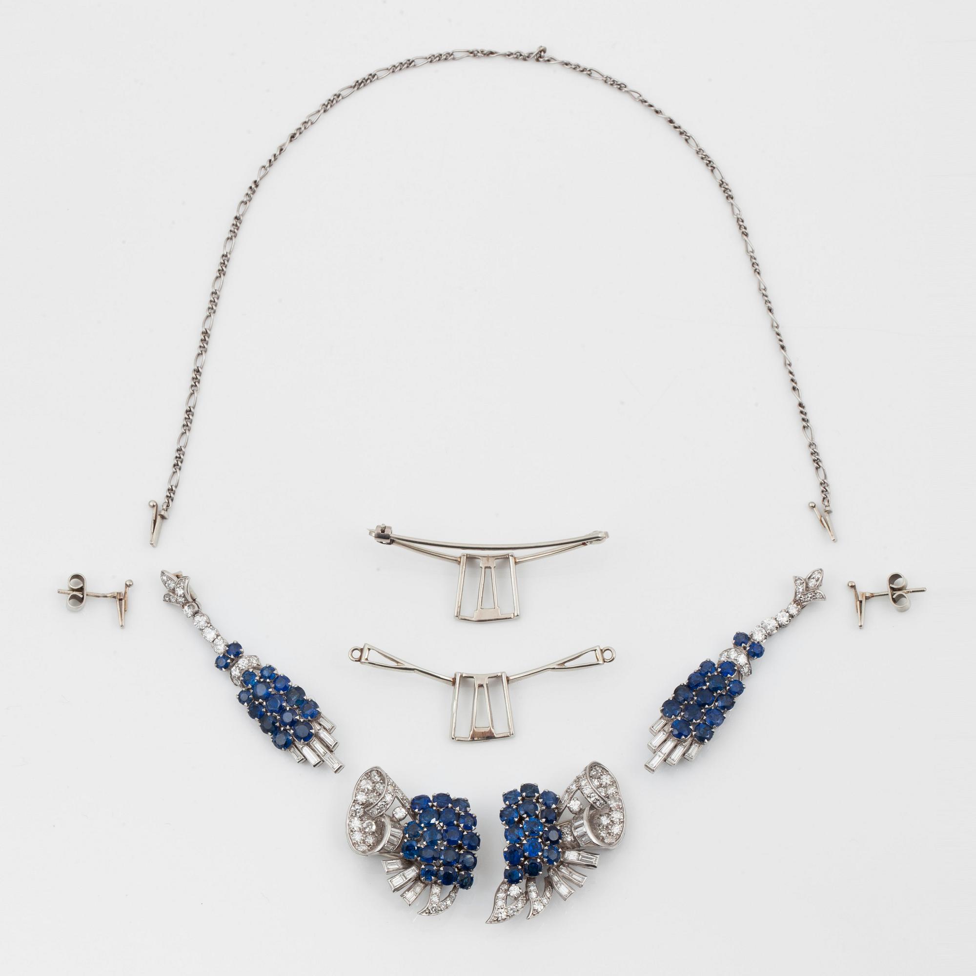 A diamond and sapphire set, probably Garrard & co. The set can be worn as a necklace, earrings, double clip or brooch.