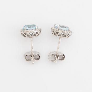 Blue topaz and brilliant cut diamond earrings and necklace.