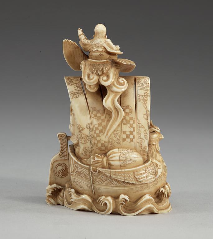 A carved sectional ivory group of Shou Lao with his crane and seven immortals in a boat, Qing dynasty, circa 1900, signed.
