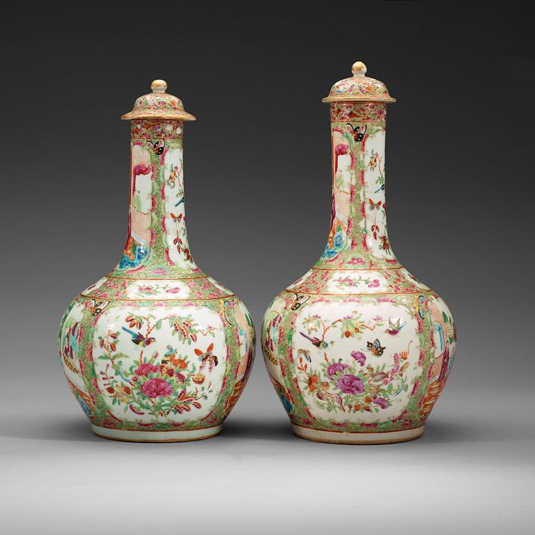 A pair of famille rose Canton vases with covers, Qing dynasty, 19th Century.