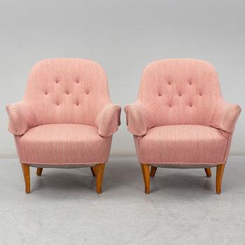 A pair of second half of the 20th Century 'Cirkus' easy chairs by Carl Malmsten.