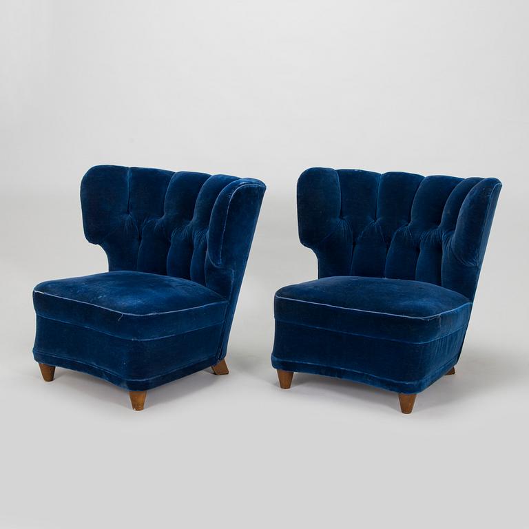 A pair of mid-20th century armchairs.