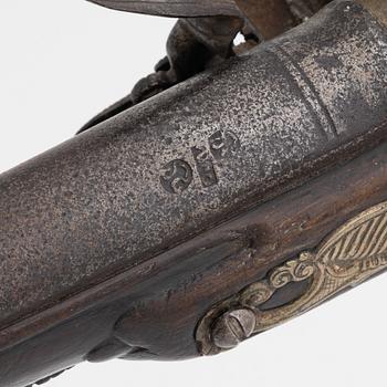 A 18th Century flintlock pistol.