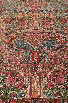 A RUG, a semi-antique Kerman "mille-fleur", ca 198,5 x 136,5 cm.