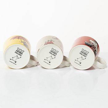 A set of 24 Moomin mugs, Arabia, Finland.