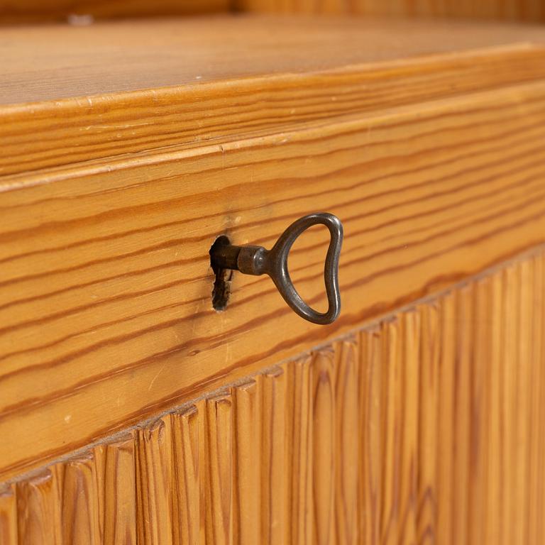 Göran Malmvall, a pinewood book case with secretaire and cabinet, second part of the 20th Century.