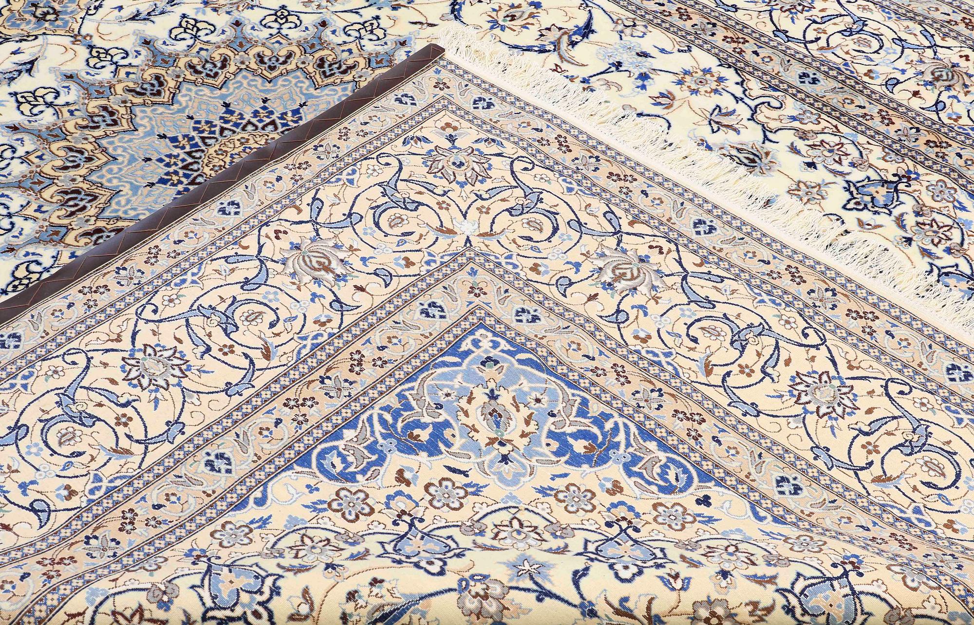 A carpet, Nain part silk s.k 9LAA, ca 355 x 260 cm.