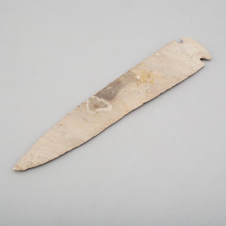 A grey flint spear head.